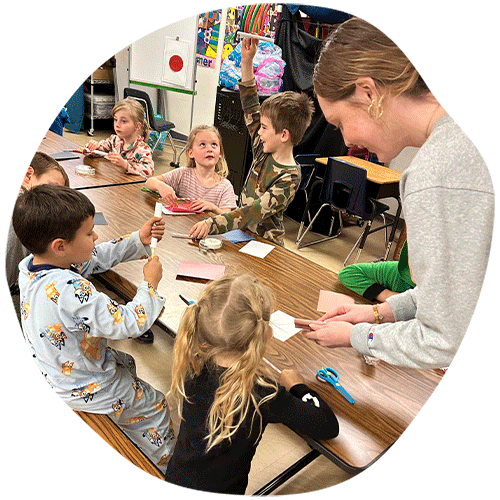 Young children learning new skills from teacher