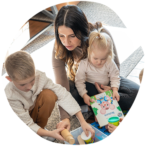 Mother and two children learning about Community, Family, and Special Services